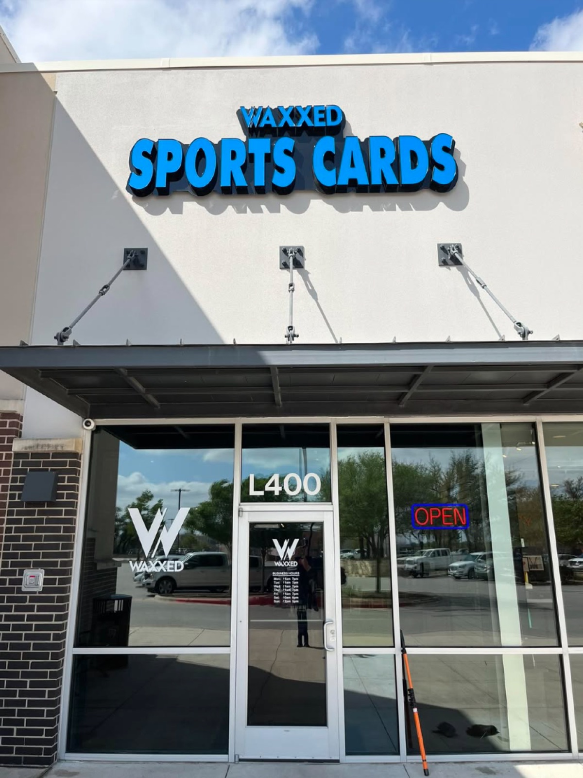 Waxxed Sports Cards storefront windows cleaned